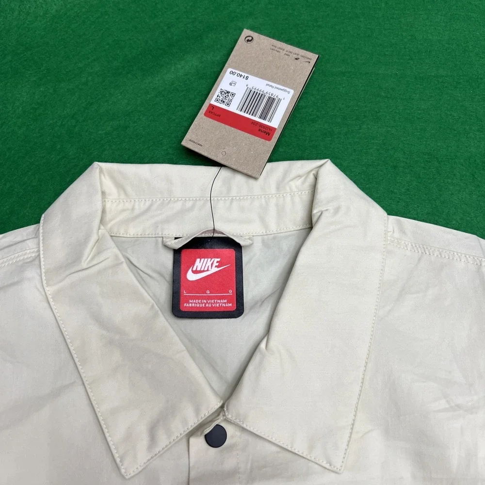 Nike tech button